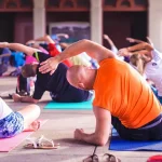 older man practicing yoga